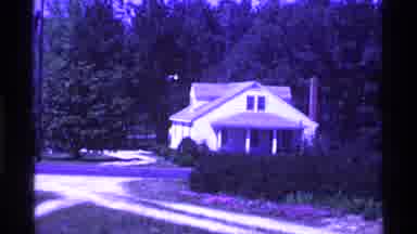 Ohio USA (1969): Camera Pans Past White House Small Cottage Field And Trees