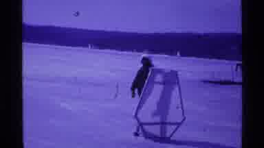 Ohio USA (1969): A Man Moving An Object On An Icy Ground And Later A Car Moving