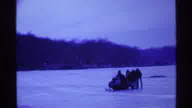 Ohio USA (1969): Five People Snowmobiling On Ice During Cold Weather