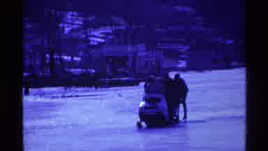 Ohio USA (1969): People On A Snow Ski With A Dog Running Behind It