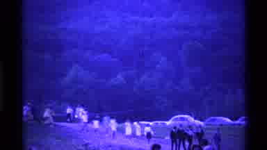 Ohio USA (1969): A Line Of People Walking Down A Dirt Path Together