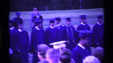 Ohio USA (1969): People In Caps And Gowns At Graduation Ceremony Walking At A Slow