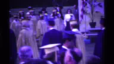 Ohio USA (1969): Graduating Students Wearing Blue And Yellow Gowns March In Line