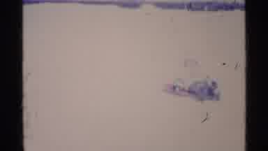 Ohio USA (1969): A Person Dressed In Winter Clothing Slides Down A Snow Covered