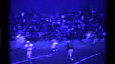Ohio USA (1969): Football Game With A Team In White And A Large Crowd