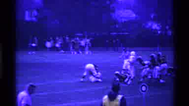 Ohio USA (1969): A Ball Is Thrown Down Field And Caught In A Football Game In Ohio