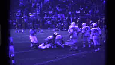 Ohio USA (1969): View Of Football Player Getting Tackled On Field On A Clear Day
