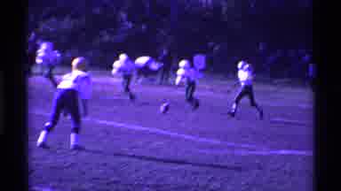 Ohio USA (1969): Football Player Kicks Ball During Game On A Sunny Day
