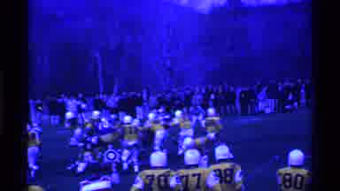 Ohio USA (1969): American Football Being Played At Dusk And Some Flashes