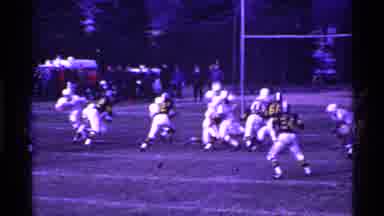 Ohio USA (1969): Football Team Play On The Field To The Glow Of Old Time Home