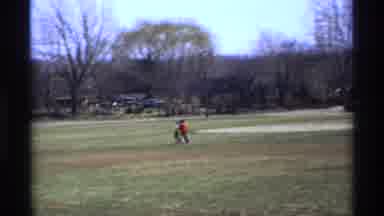 Florida Michigan (1970): Person Wearing Red Shirt Walks With Two Kids In Park On A
