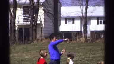 Florida Michigan (1970): A Family Man Plays With His Children In A Green Park And