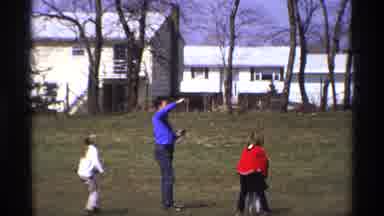 Florida Michigan (1970): People Flying Kites In The Sky While In A Field
