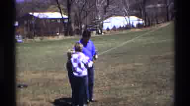 Florida Michigan (1970): Father Helps His Son And Daughter Fly A Kite And Holds It