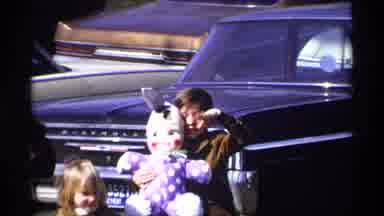 Florida Michigan (1970): Kids In The Parking Lot Alongside Their Mom Wave Holding