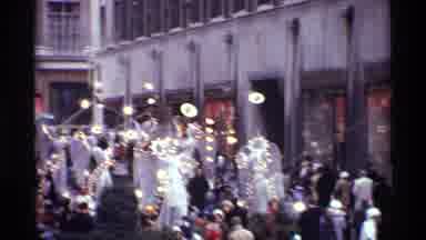 New York City (1970): Camera Zooms In On The Scene Filled With People And Lights