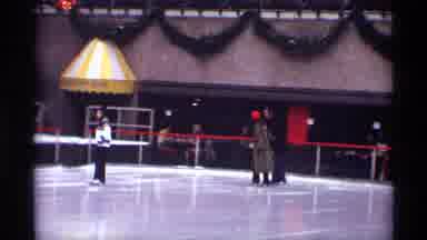 New York City (1970): Couple Ice Skating At The Rink At Rockefeller Center In New