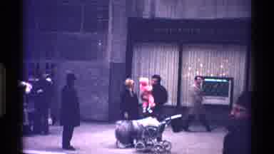 New York City (1970): Large Sheepdog Walks Behind Person Wearing Black Coat On A