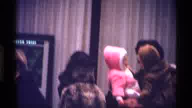 New York City (1970): A Couple With A Child In Front Of A Store With A Picture In