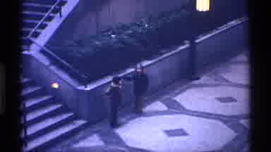 New York City (1970): Two People Run To Lit Streetlight On A Clear Evening