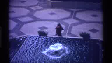New York City (1970): Kid Boy Outside Plants Water Zoom-In Gloves Coat Waterfall