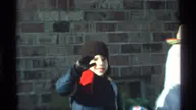 New York City (1970): Young Boy Waving To Camera Standing Behind Little Girl Both