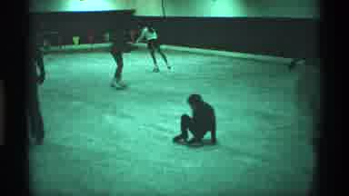 New York City (1970): A Child Having Difficulties Skating And Being Help By His