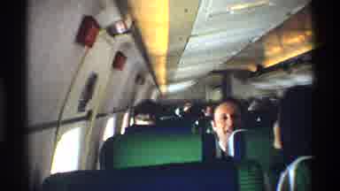 New York City (1970): Large Group Of People Talking On A Plane To Each Other