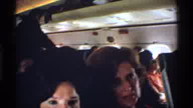 New York City (1970): Woman On The Plane Talks To The Camera As It Zooms In On Her