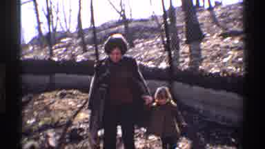New York City (1971): Woman Holds Child's Hand And They Walk Together In The Park