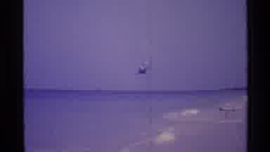 Florida USA (1973): Helicopter Flies Low Over The Beach As People Stand And Watch