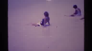 FLORIDA USA-1973: Children Playing In The Ocean Waves At The Beach