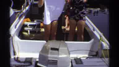 New York (1973): Two Older Women Holding White Shirt In Bathing Suits On Boat In