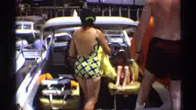 New York (1973): Woman Wearing Black And Yellow Swimwear Dries Off With Yellow
