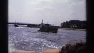New York (1973): A Young Man On The Lake With Boats Behind
