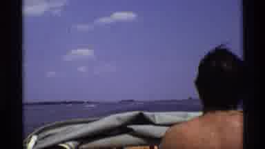 New York-1973: Summer Time Relaxation Enjoying A Boat Ride On The Lake