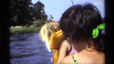New York (1973): Children Wear Life Jackets And Swim Suits In Boat On Water