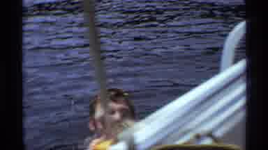 New York (1973): A Child Is Swimming In The Sea Together With His Dad