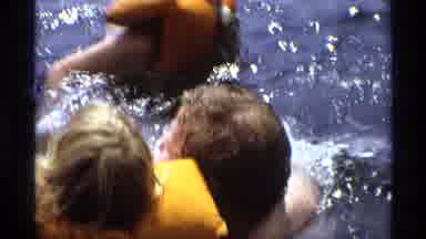 New York (1973): Family Swims In Lake With Life Vests And Inflatable Boat