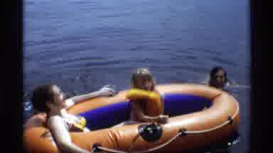 New York (1973): A Woman Man And Child In An Inflatable Raft In A Lake Enjoying