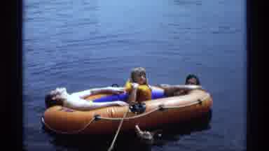 New York (1973): Two Guys And A Young Girl With A Yellow Inflatable Jacket In An