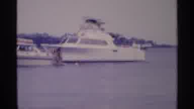 New York (1973): Two White Boats Are Out On The Water On A Bright Sunny Day