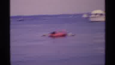 New York (1973): A Lady In Water On A Raft Paddling Relaxing Behind A Boat