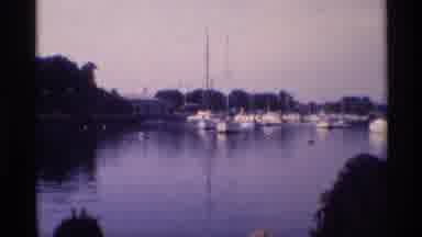 New York (1973): A Person Looks Over A Marina In A River Or Ocean Bay