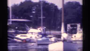 New York (1973): White Boats Sailing By The Dock Where Several Other Boats Are Not