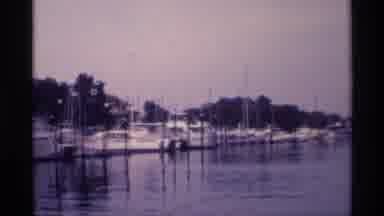 New York (1973): Camera Zooms In On Group Of Small Boats At Anchor In Harbor
