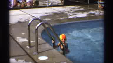 New York (1973): Girl Wearing Pink Swimwear Climbs Out Of Pool On A Bright Sunny