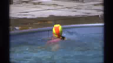 New York (1973): Young Girl Wearing A Pink And Black Bathing Suit Swimming To The