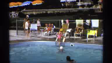 New York (1973): Girl Wearing Red And Yellow Swim Cap Climbs Out Of Swimming Pool