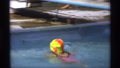 New York (1973): Child In A Neon Swim Cap And Pink Swimsuit Swims To The Edge Of